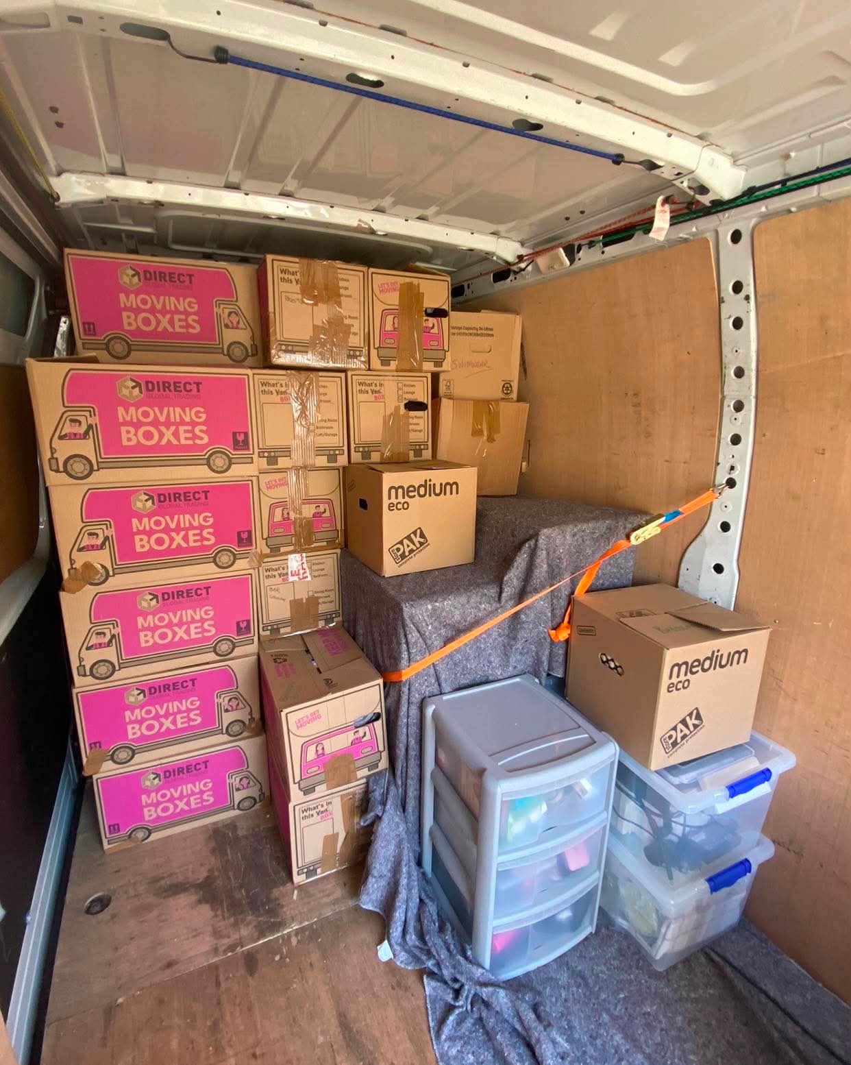 Removal van neatly loaded with stacked moving boxes
