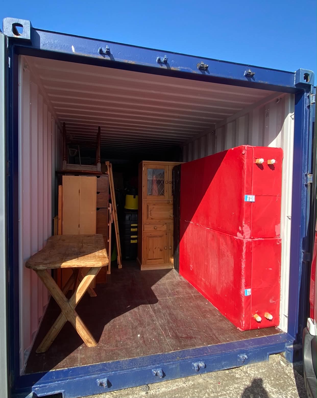 Open storage container packed with furniture in East Sussex